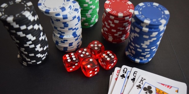 How do online poker websites make cash?